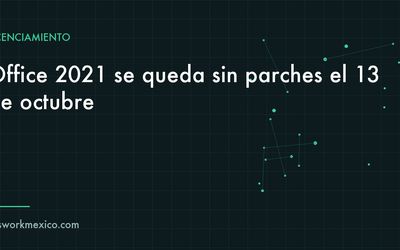 Escritorio de oficina con una hoja de cálculo abierta y un aviso de fin de soporte en la pantalla